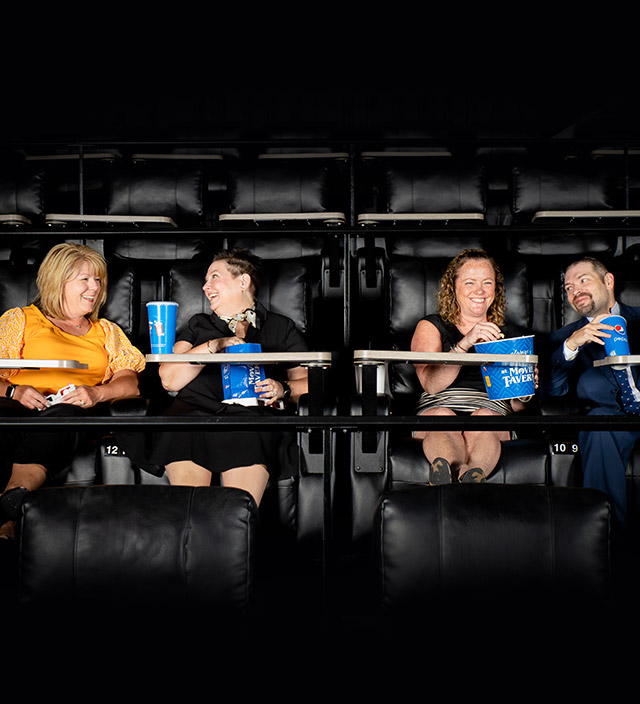 Visit Brookfield team sitting in movie theater together